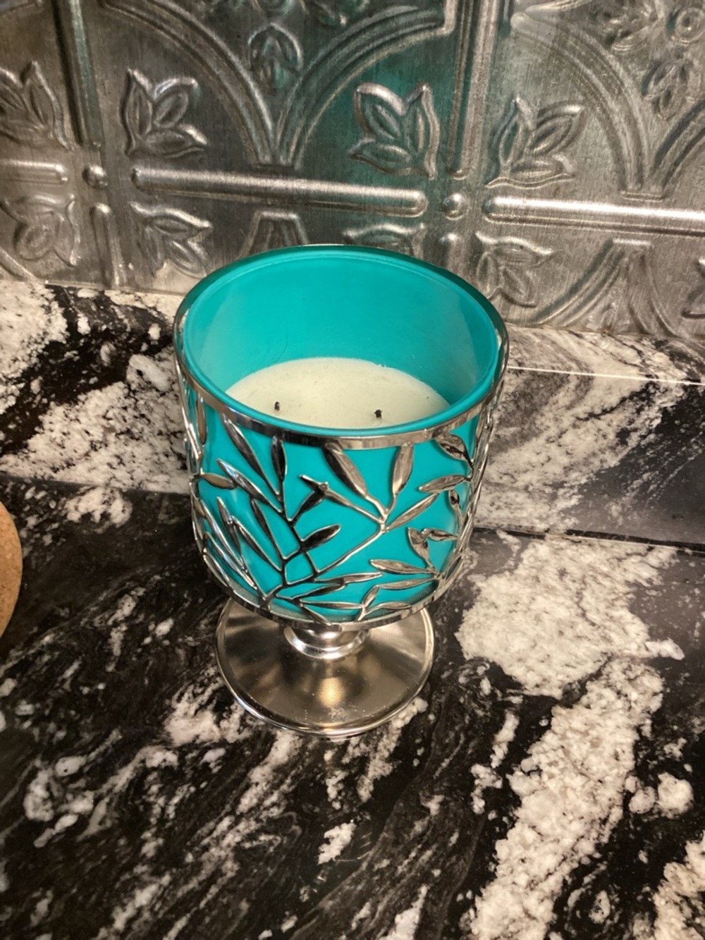 Teal Leaf-Accent Glass Pedestal Candle (Brand Not Visible)